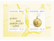 Ett motiv med texten 'svårt och vanskligt läge och ett med Bragdmedaljen i guldfolie.